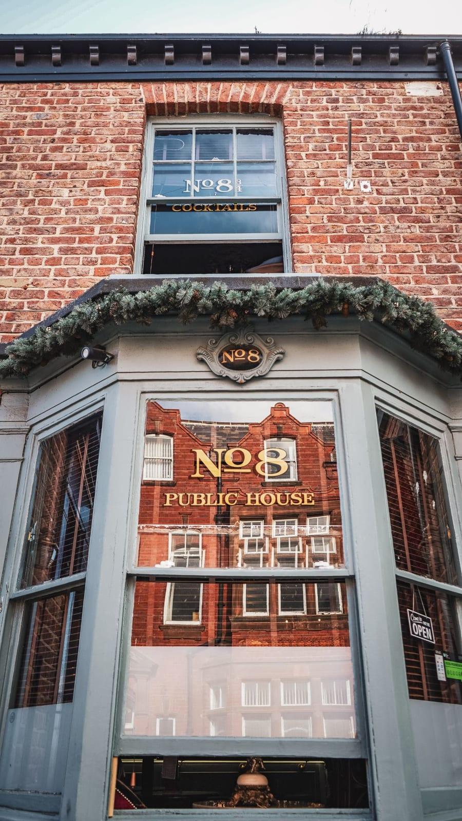The No.8 Public House bay window with gold lettering